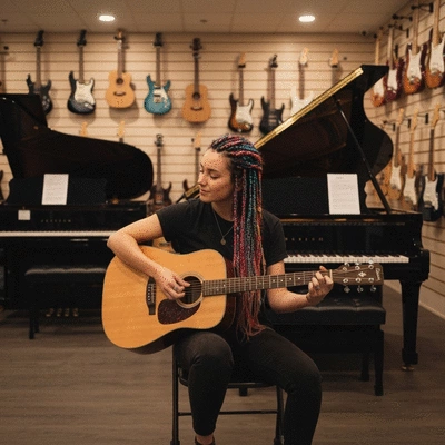 Musician playing an acoustic guitar in a local music shop, surrounded by instruments, soft lighting, no text, no words, no typography, clean image